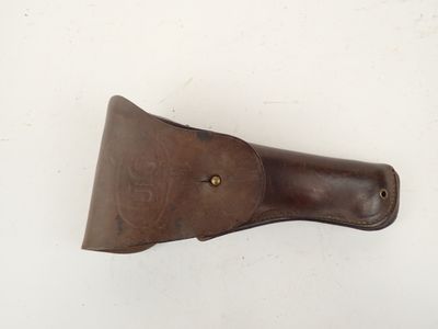 brown leather sheath for a knife on a white surface