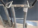 a metal stand with a pair of handles on it