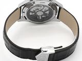 a watch that is sitting on a black leather strap