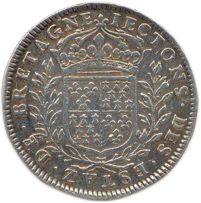 a silver coin with a crown on top of it