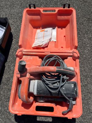 a tool in a case that is sitting on the ground