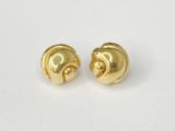 a pair of gold plated earrings on a white surface