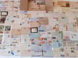 a box that is sitting on top of a table covered in postcards