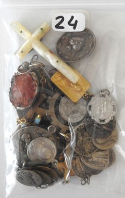 a bag full of coins and a cross on top of it