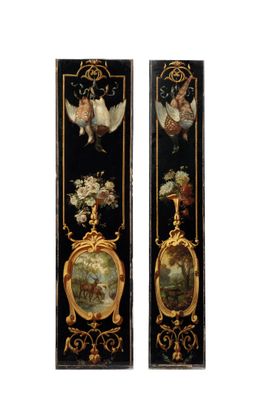 pair of black and gold painted wall plaques with angels and flowers