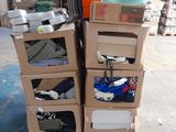 many boxes of shoes stacked on top of each other