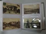 a person holding a book open to show pictures of a city