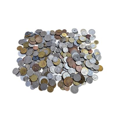a pile of coins sitting on top of a white surface