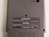 an image of a nintendo game cartridge sitting on top of a table