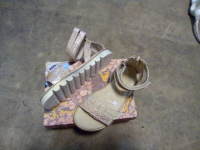 a pair of shoes that are on top of a box