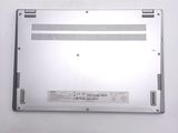 the bottom of a laptop with a metal cover on a white surface