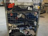 a metal cart with a lot of clothing on it