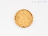 an image of a gold coin sitting on top of a white surface