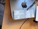 a keyboard and a mouse on a desk next to an apple computer