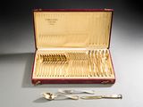a red case with silverware in it on a table