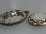 pair of silverplated dishes and a silverplated bowl on a table