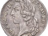 a close up of a coin with a woman ' s face on it