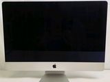 an apple computer monitor sitting on top of a white table