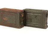pair of green and brown metal boxes on a white surface