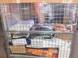 a large metal cage with many items inside of it