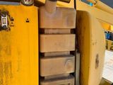 a close up of the back end of a yellow truck