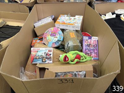 a cardboard box filled with toys and other items
