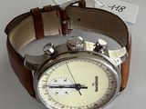 a watch that is sitting on a white surface