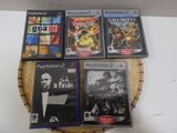 several video games are sitting on a wicker basket on a table