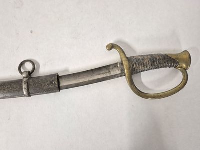 an image of a sword that is on a white surface