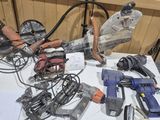 a table with a bunch of power tools on it