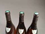 three bottles of wine sitting next to each other on a table