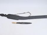 an old knife and a small knife on a white surface