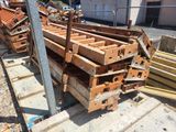 several pieces of wood are stacked on top of each other in a pile