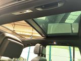 a view of the sunroof from inside of a car