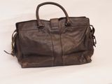 brown leather handbag on a white background
