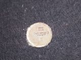 a close up of a coin on a black surface