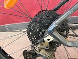 a close up of a bicycle wheel with a chain on it