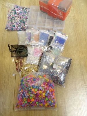 a bag of sprinkles and a bag of beads on a table
