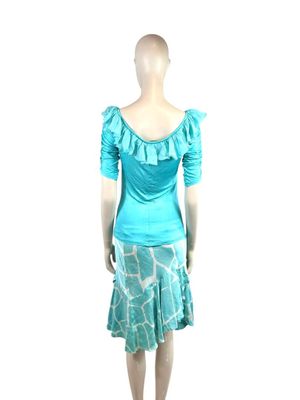 the mannequin is wearing a blue dress with a giraffe print on it
