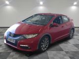 the red honda civic is parked on a checkered floor