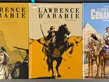 three books on a shelf with a picture of a man riding a horse