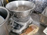 a large metal bowl sitting on top of a kitchen counter