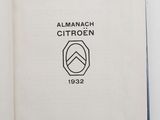 an open book with a picture of an emblem on it