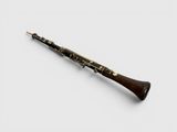 a close up of a clarinet on a white surface