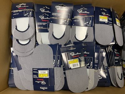 several pairs of men ' s socks are in a box on display