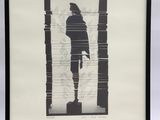 shadow of a man holding a tennis racquet in front of a window