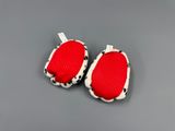 pair of red and black slippers with polka dots on them