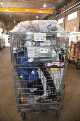 a large metal cart with a lot of items inside of it