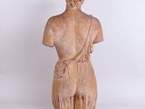an image of a wooden statue of a man with a hat on his head