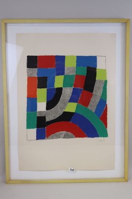 a framed picture of a colorful abstract painting on a white wall
